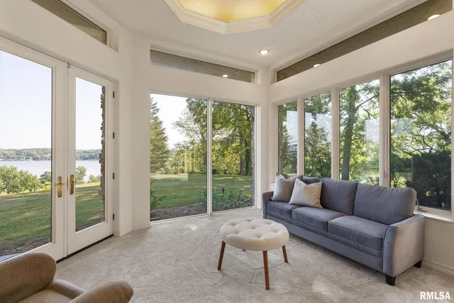 an aerial view of a houses with a lake view