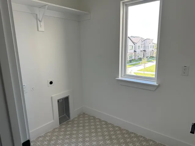 a kitchen with stainless steel appliances granite countertop a refrigerator a stove a sink and a microwave oven with wooden floor