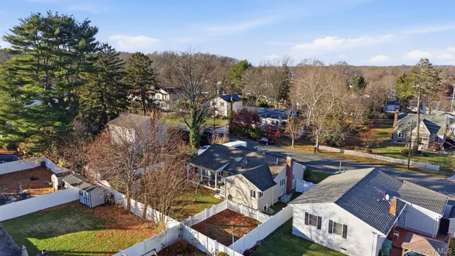 an aerial view of residential house with parking