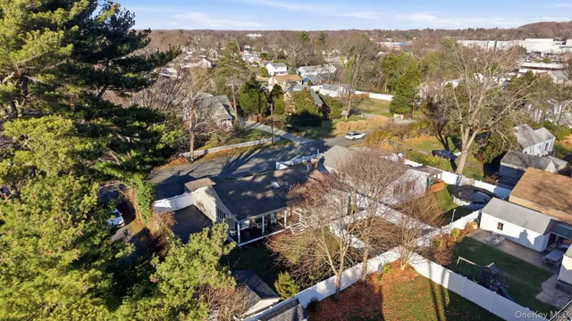 an aerial view of residential house with green space