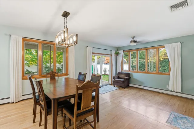 a view of a dining room with furniture window and outside view