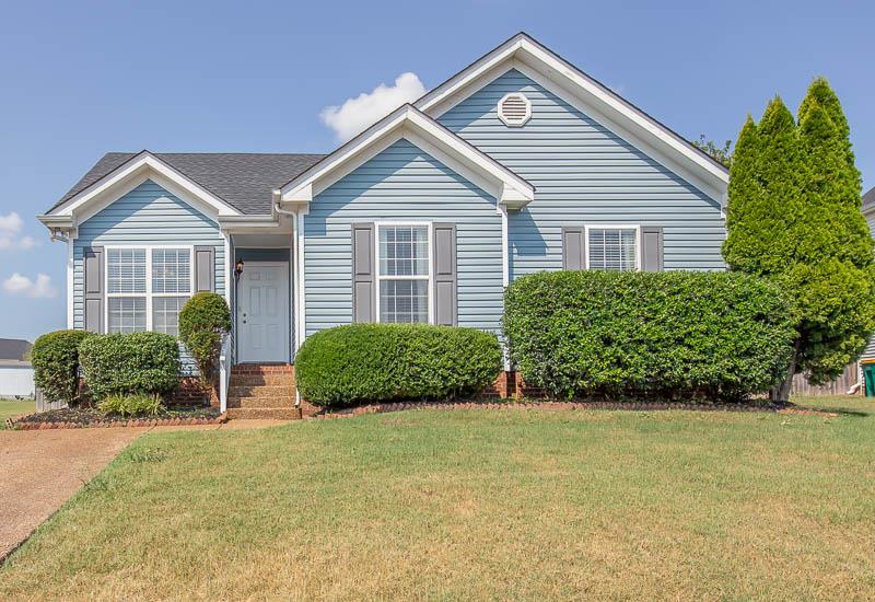 2242 Dewey Drive Spring Hill, TN 37174 - Photo 1 of 29 a front view of a house with a yard