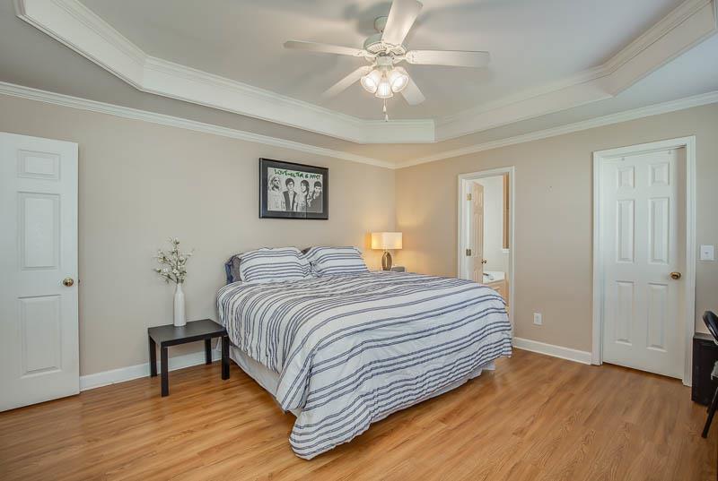 2242 Dewey Drive Spring Hill, TN 37174 - Photo 16 of 29 a bedroom with a bed and a chandelier