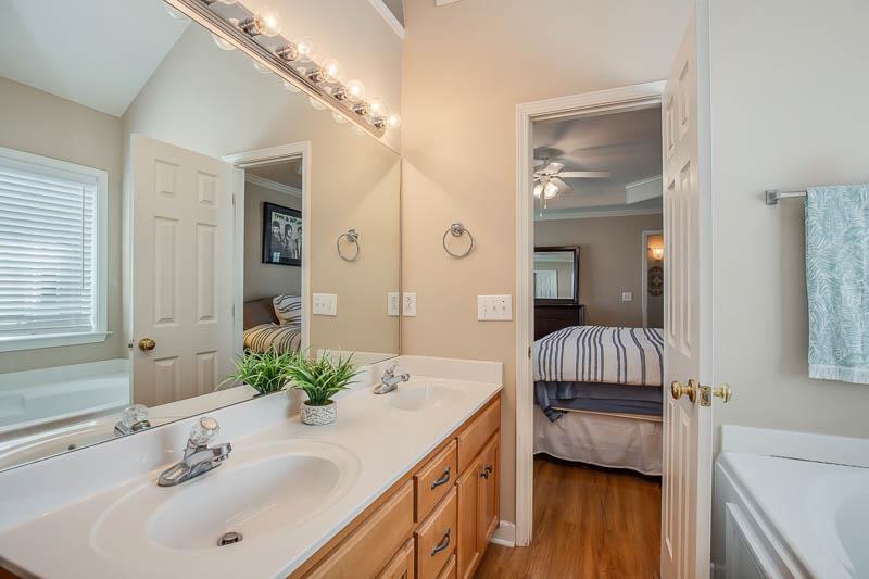 2242 Dewey Drive Spring Hill, TN 37174 - Photo 19 of 29 a en suite bathroom with a sink and a large mirror