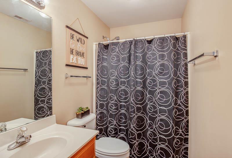 2242 Dewey Drive Spring Hill, TN 37174 - Photo 22 of 29 a bathroom with a toilet and a shower curtain