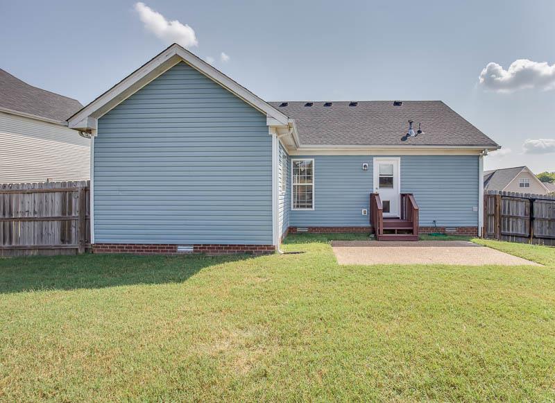 2242 Dewey Drive Spring Hill, TN 37174 - Photo 23 of 29 a view of a house with backyard and porch