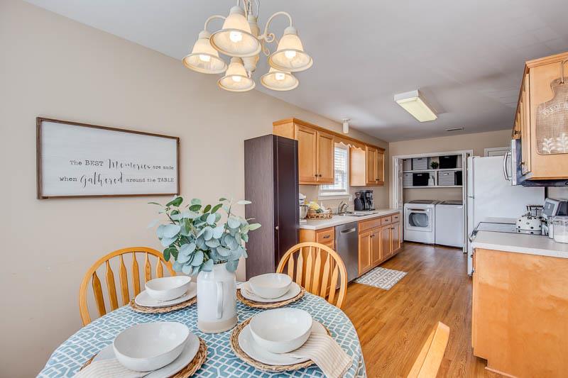 2242 Dewey Drive Spring Hill, TN 37174 - Photo 8 of 29 a living room with furniture potted plant and a chandelier