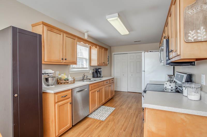 2242 Dewey Drive Spring Hill, TN 37174 - Photo 10 of 29 a kitchen with stainless steel appliances granite countertop a sink a stove and cabinets