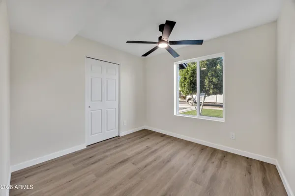 a view of room window and wooden floor
