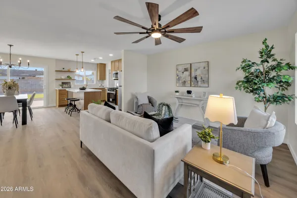 a living room with furniture and a potted plant