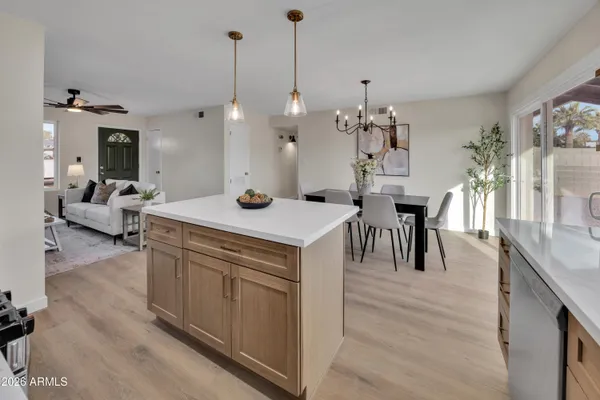 a view of living room with furniture and chandelier