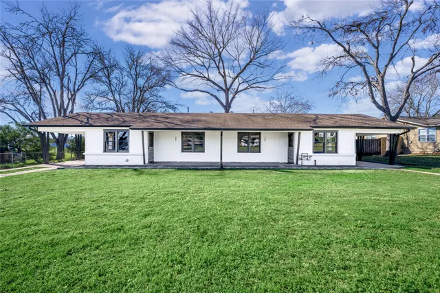 front view of a house with a yard