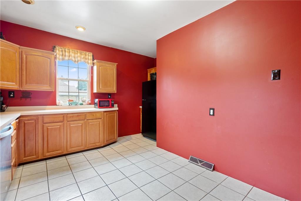 197 William Street McKees Rocks, PA 15136 - Photo 12 of 25 a kitchen with sink a window and cabinets