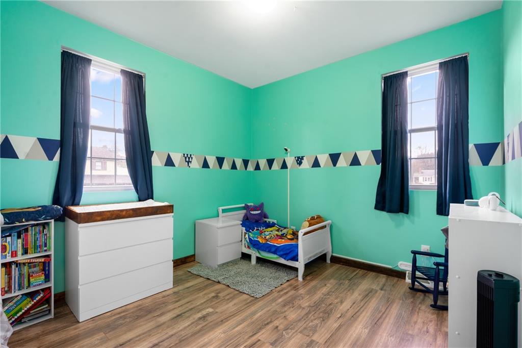 197 William Street McKees Rocks, PA 15136 - Photo 13 of 25 a living room with furniture and a book shelf