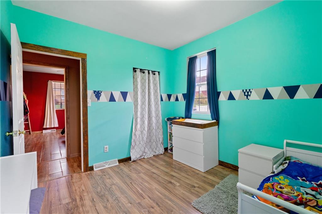 197 William Street McKees Rocks, PA 15136 - Photo 14 of 25 a bedroom with furniture and a large window