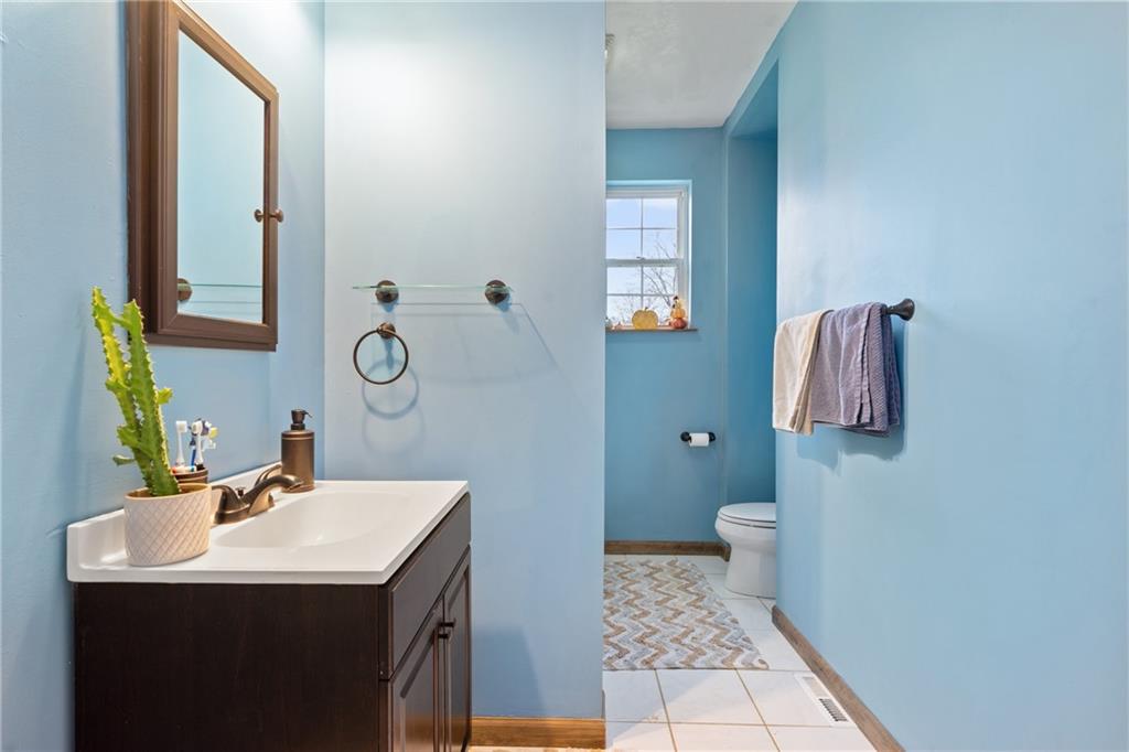 197 William Street McKees Rocks, PA 15136 - Photo 16 of 25 a bathroom with a sink toilet and mirror