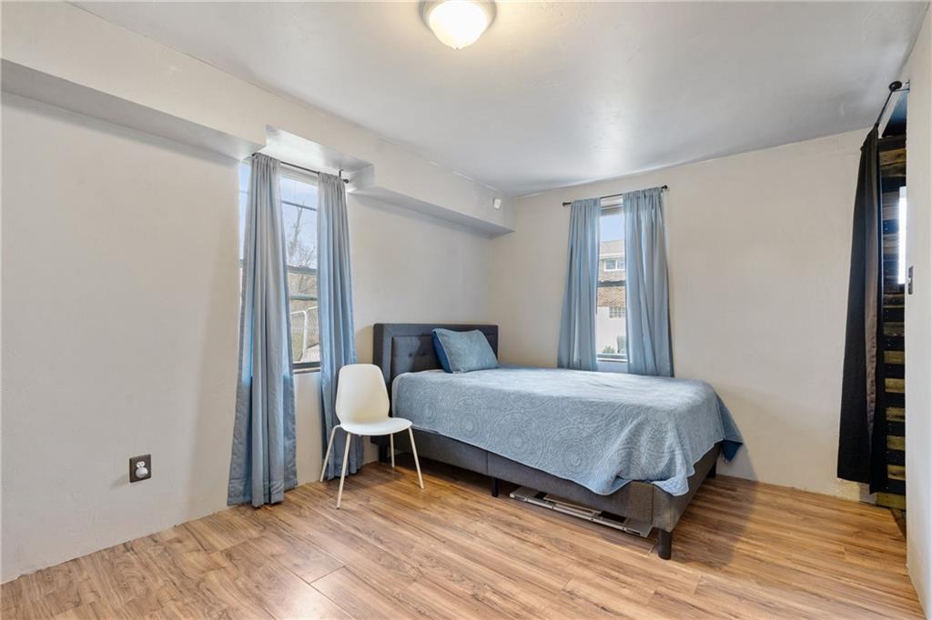 197 William Street McKees Rocks, PA 15136 - Photo 20 of 25 a bedroom with a bed and a window