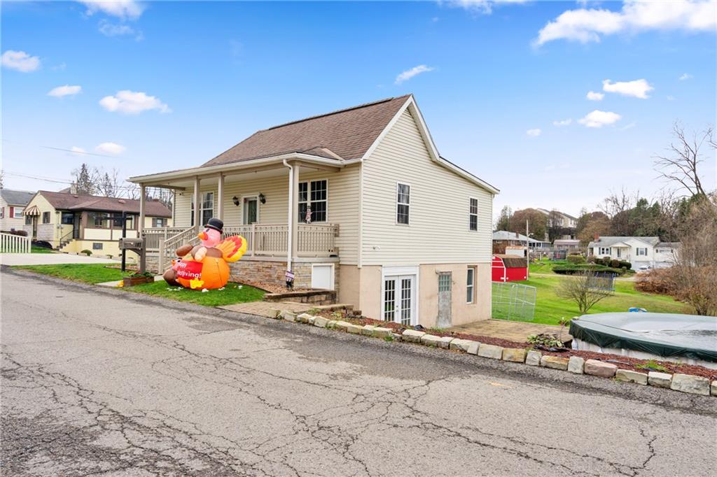 197 William Street McKees Rocks, PA 15136 - Photo 2 of 25 a view of a small house in front of a house with wooden fence