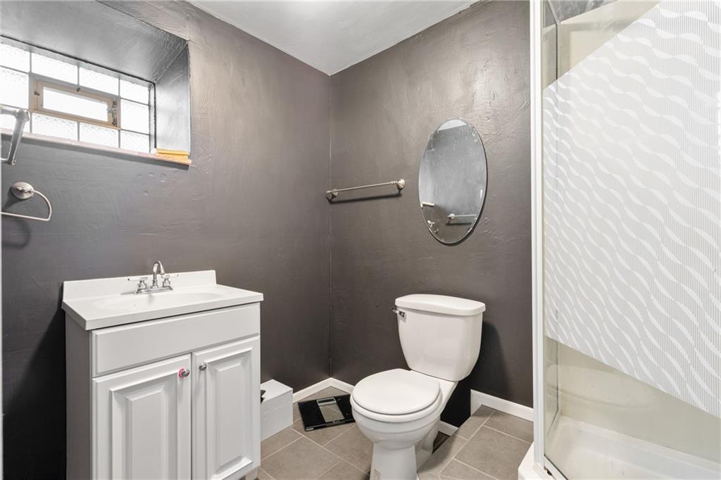 197 William Street McKees Rocks, PA 15136 - Photo 22 of 25 a bathroom with a toilet sink and mirror