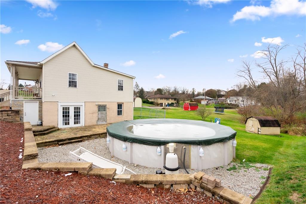 197 William Street McKees Rocks, PA 15136 - Photo 24 of 25 a view of a white house with a yard porch and outdoor seating
