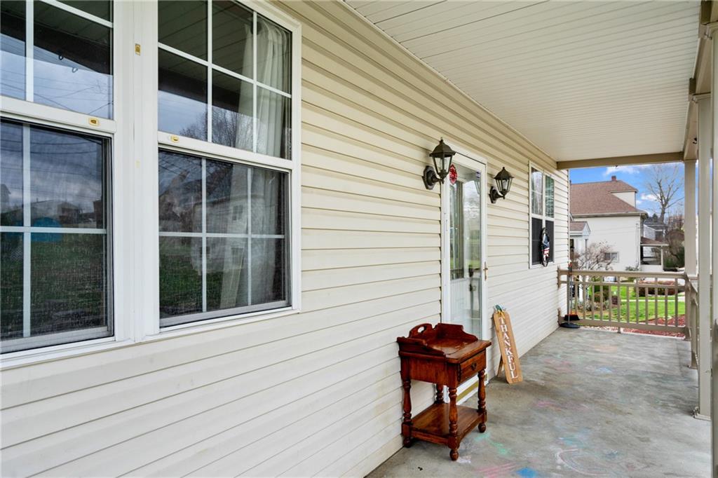197 William Street McKees Rocks, PA 15136 - Photo 5 of 25 a view of a house with a large window and chair