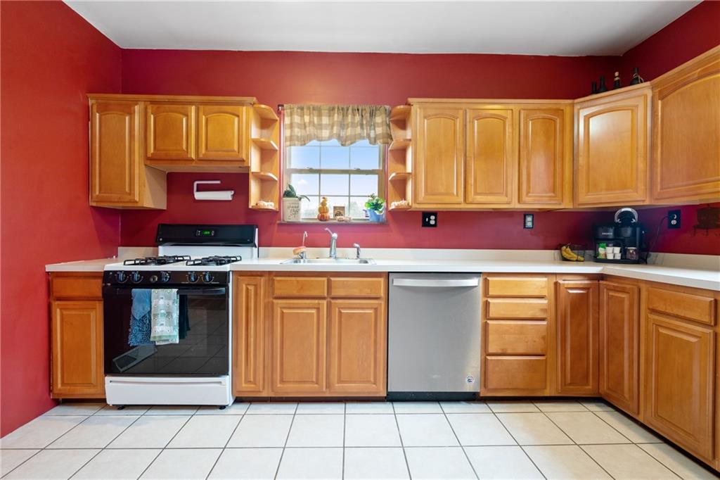 197 William Street McKees Rocks, PA 15136 - Photo 8 of 25 a kitchen with stainless steel appliances a stove sink and cabinets
