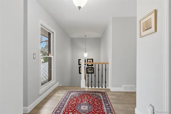 a view of a hallway with windows