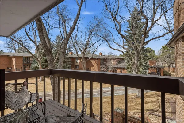 a view of a balcony with wooden fence