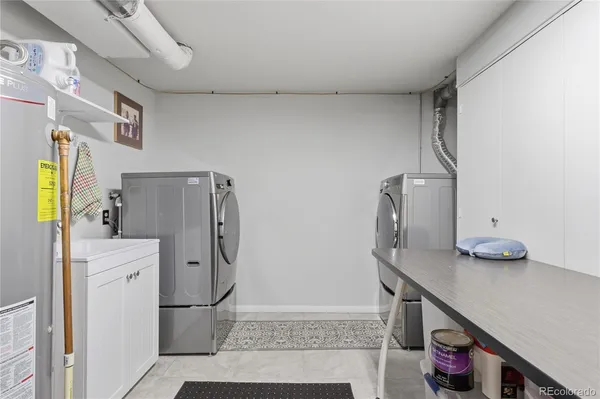 a kitchen with stainless steel appliances granite countertop a sink and refrigerator