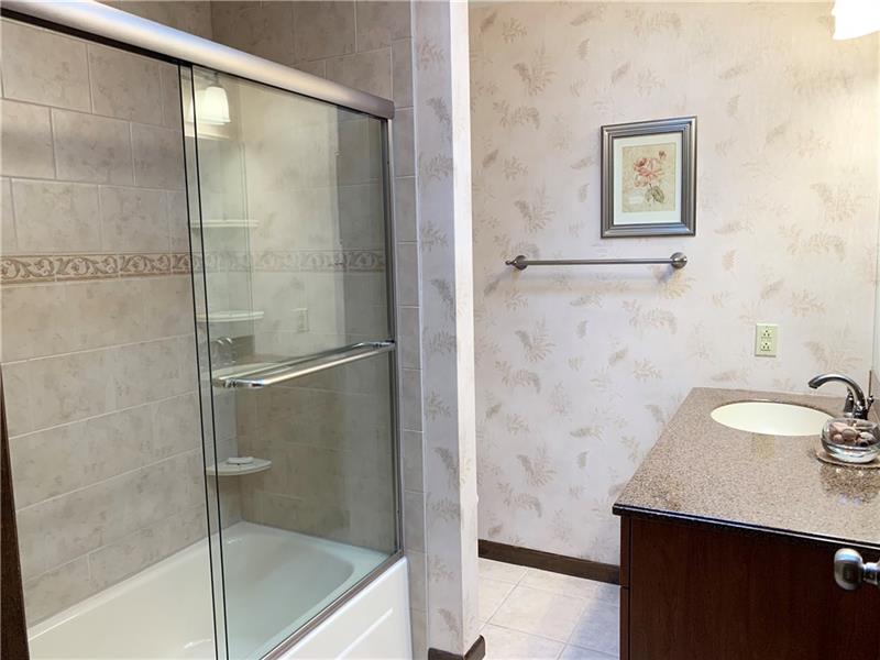 3241 Ridgeway Road Greensburg, PA 15601 - Photo 14 of 25 Mater bath with updated tiled shower surround and doors.