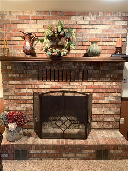 3241 Ridgeway Road Greensburg, PA 15601 - Photo 20 of 25 gas bricked fireplace in the family room with wood mantle.