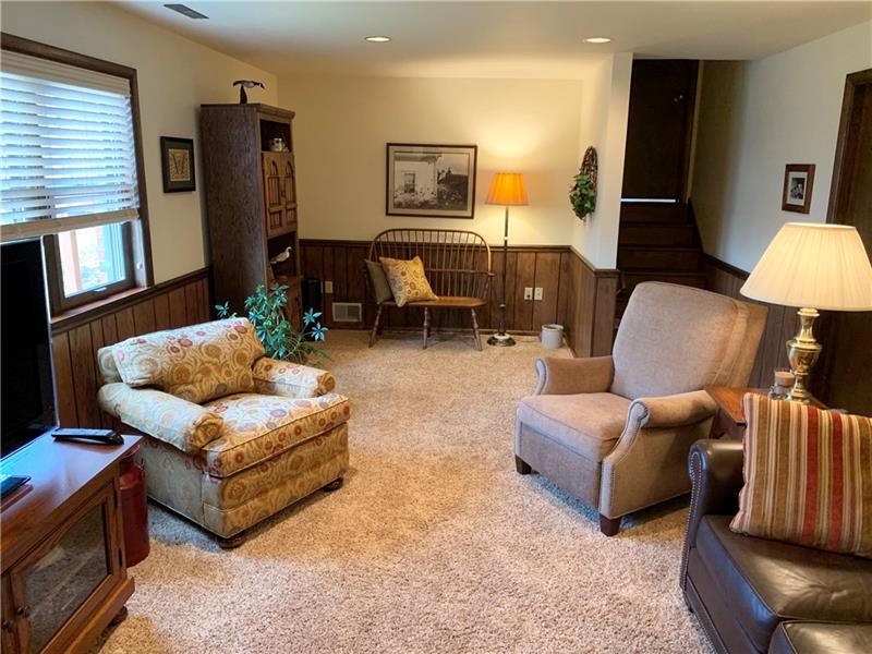 3241 Ridgeway Road Greensburg, PA 15601 - Photo 21 of 25 Family room with neutrally painted walls and neutral carpeting.