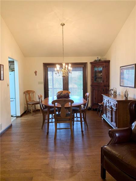 3241 Ridgeway Road Greensburg, PA 15601 - Photo 7 of 25 A view of the dining room with vaulted ceilings, hard wood flooring and the french door that leads to the covered rear deck.