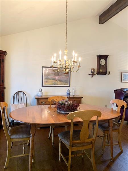 3241 Ridgeway Road Greensburg, PA 15601 - Photo 8 of 25 The dining room with hard wood floors, vaulted ceilings and neutrally painted walls.