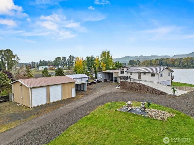 a view of a lake with couches and city view