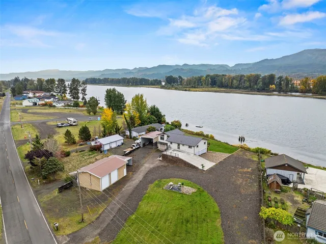 an aerial view of a house with a lake view