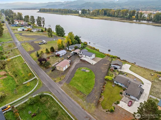 an aerial view of a house with a lake view