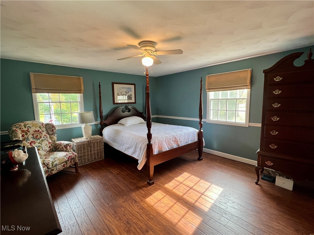 446 Annis Road Amherst, OH 44001 - Photo 21 of 39 Bedroom featuring hardwood / wood-style floors and ceiling fan