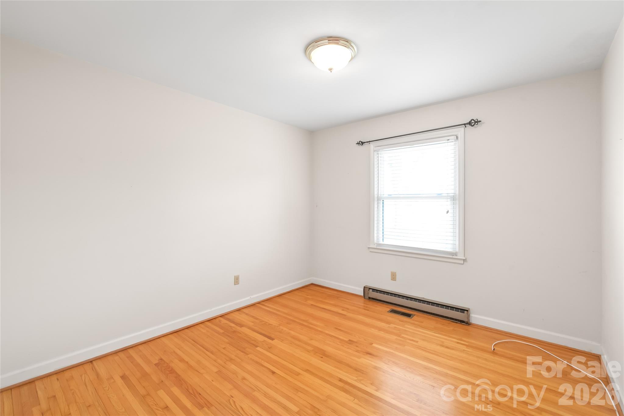 105 West Sunset Drive Locust, NC 28097 - Photo 16 of 24 an empty room with a window