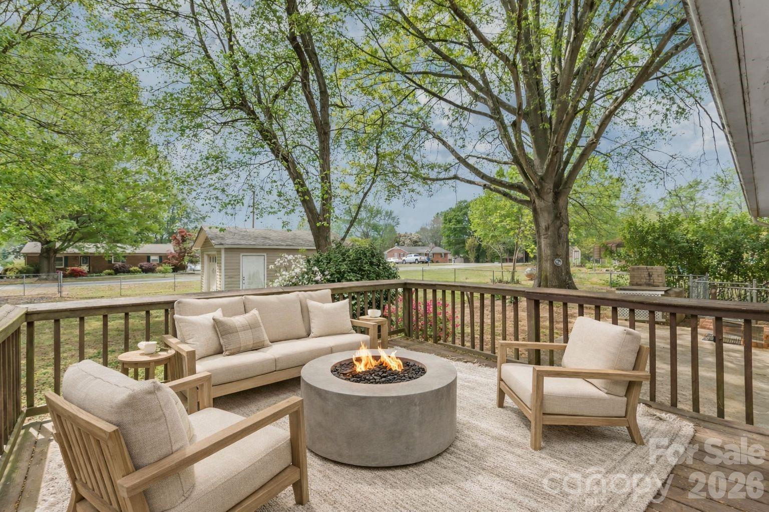 105 West Sunset Drive Locust, NC 28097 - Photo 20 of 24 a view of a patio with couches and a fire pit