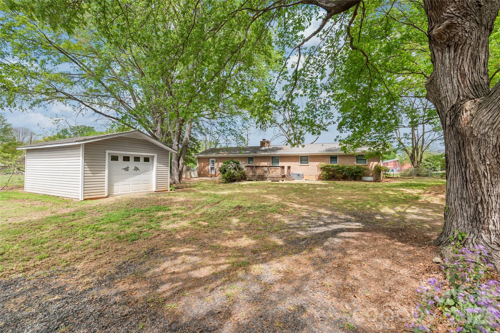 105 West Sunset Drive Locust, NC 28097 - Photo 23 of 24 a front view of a house with garden
