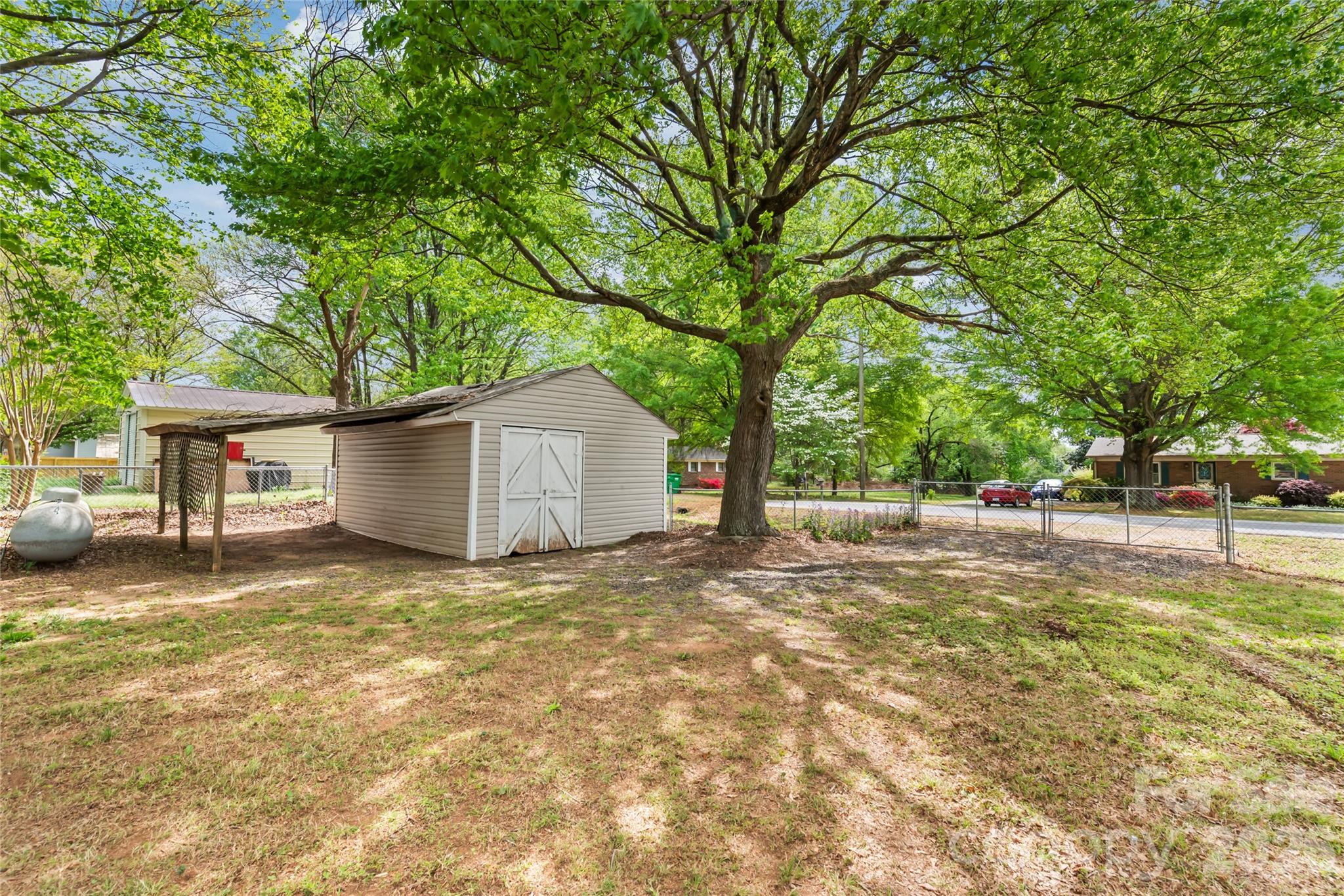 105 West Sunset Drive Locust, NC 28097 - Photo 24 of 24 a view of a house with a yard and large tree
