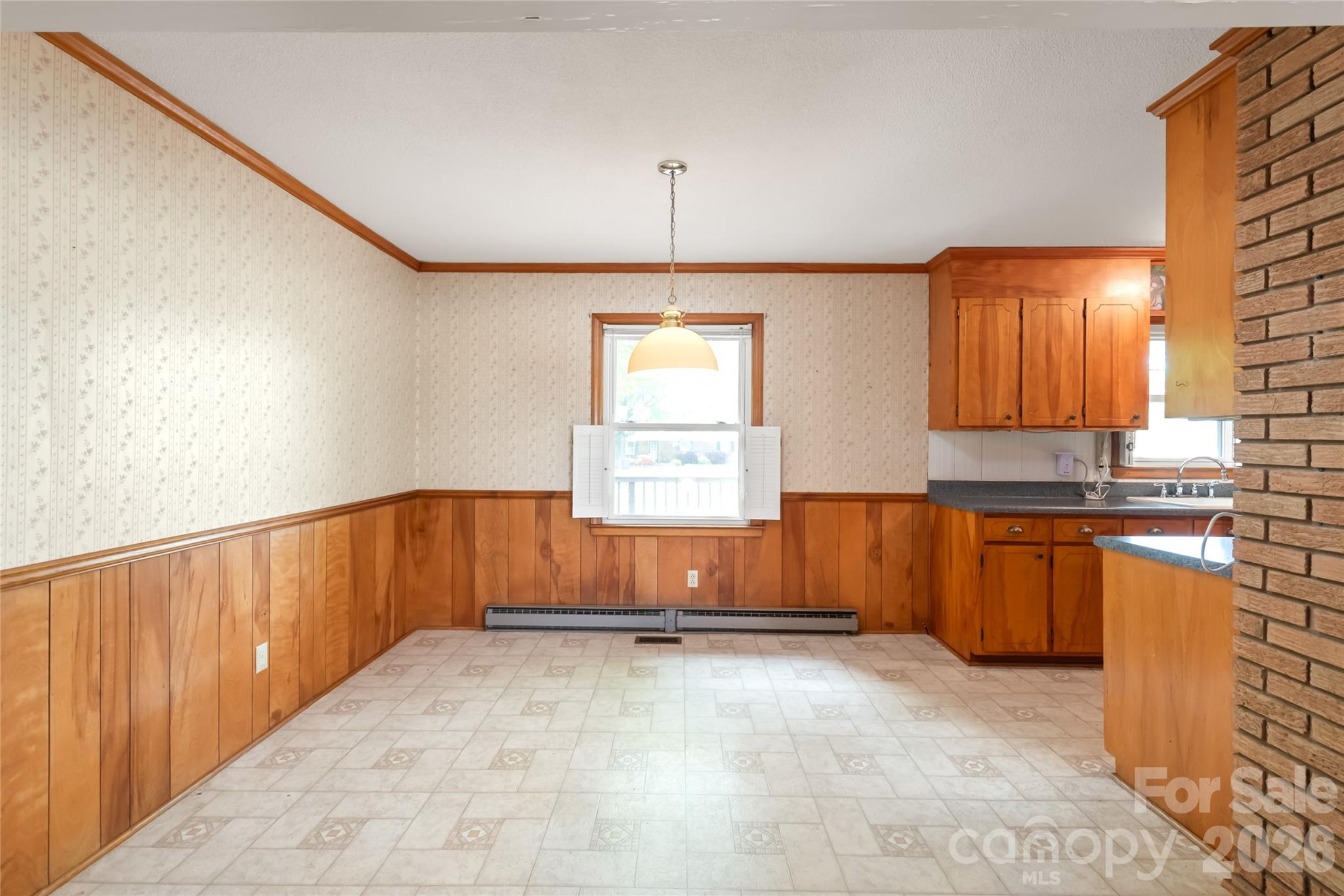 105 West Sunset Drive Locust, NC 28097 - Photo 8 of 24 a view of a kitchen with a sink and dishwasher cabinet with a open kitchen