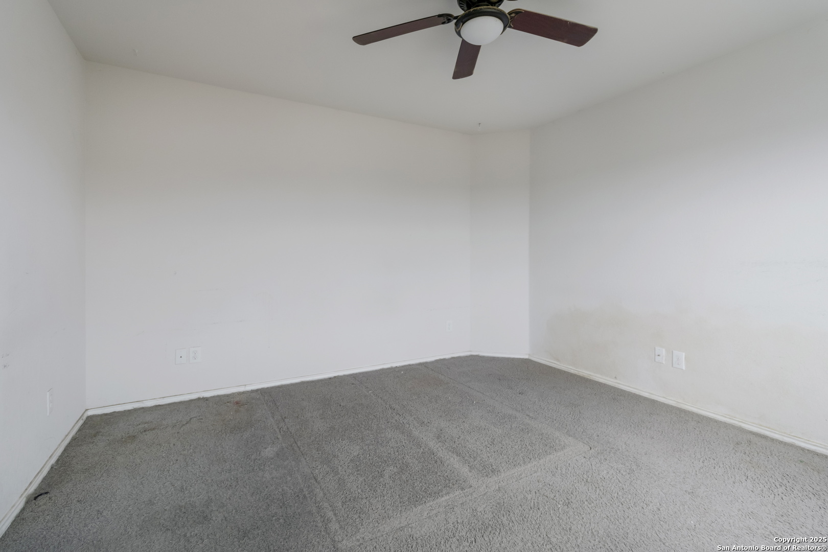 5965 Kendall Prairie Converse, TX 78109 - Photo 11 of 14 an empty room with a ceiling fan and window