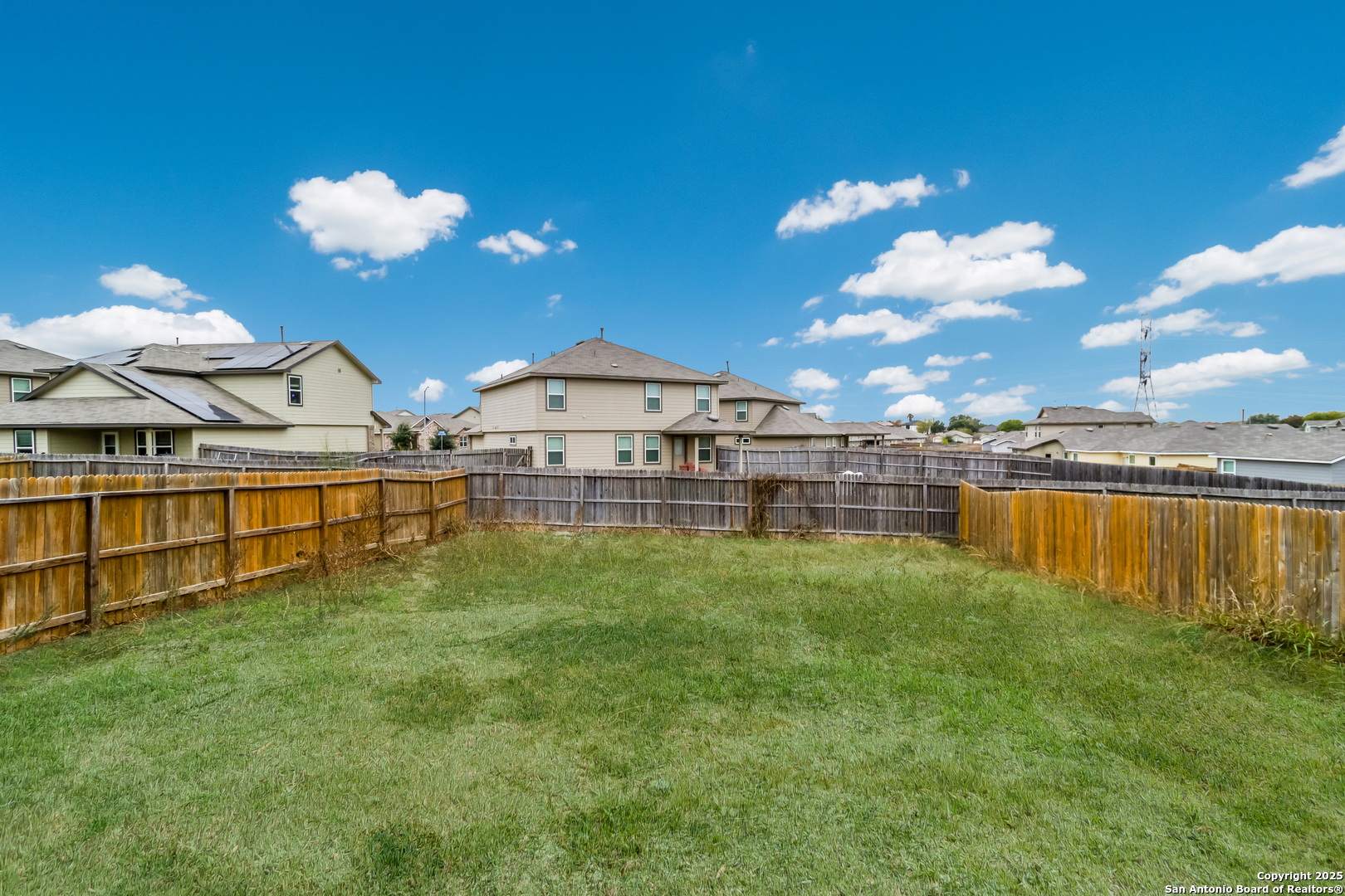 5965 Kendall Prairie Converse, TX 78109 - Photo 13 of 14 a view of a house with pool and a yard