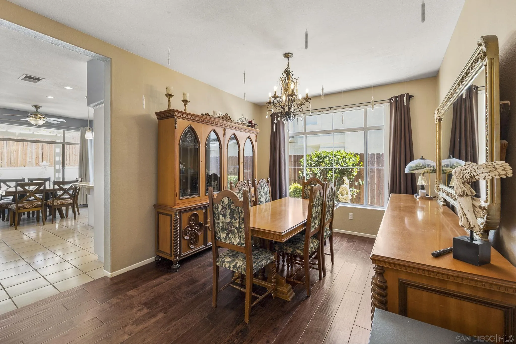 838 Masters Drive Oceanside, CA 92057 - Photo 13 of 39 a view of a dining room with furniture window and wooden floor