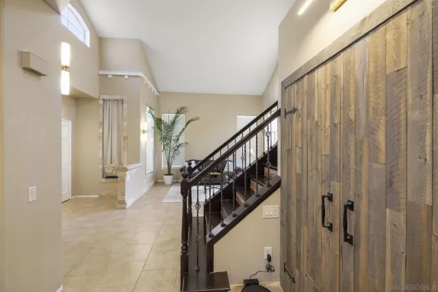 a view of a kitchen with white cabinets