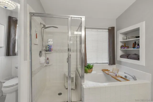 a view of a patio with table and chairs potted plants and palm tree