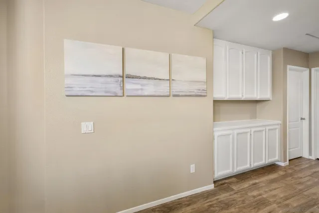 a view of a patio with a table and chairs