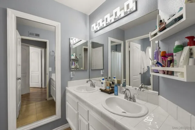 a front view of a house with a yard table and chairs